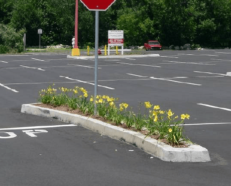 Whether installed in a trench or directly on the asphalt binder, machine extruded curb can be installed in any location.