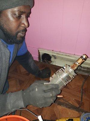 Repairing heating line that burst during the cold snap.