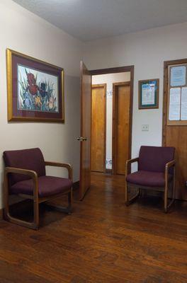 Part of the waiting room, nice comfortable chairs and very clean.