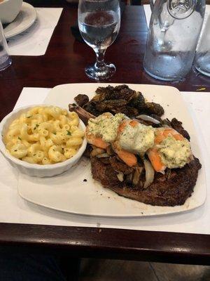 Cowboy Ribeye w/shrimp add, onion/mushrooms, Brussels sprouts, macaroni and cheese. Delicious!