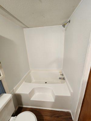 Cleaned this bath tub after construction remodel. It was stained with  hard water spots, caulk stuck to it and now it looks brand new