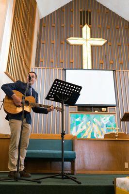 Pastor Clark leading worship.