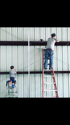 Like father like son. My baby helping his daddy! This was a metal workshop that I had ran all the electrical for. Cute picture to share. :)