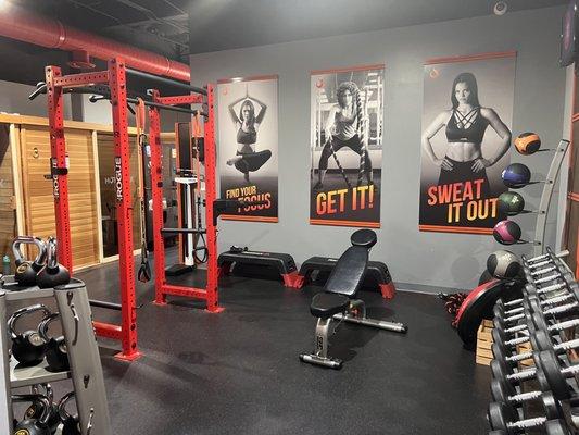 Weightlifting gym in the back of facility