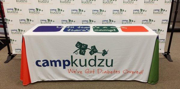 Runway Backdrop Banners and Table Throws help brand you!