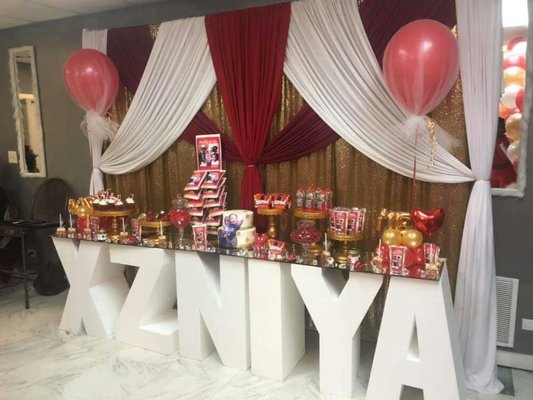 Custom letter table sweets package and draped backdrop