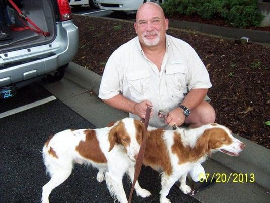 Billy Harwell, Co Owner of Dog Walkers & More with two of the dogs we transported to their new foster home.