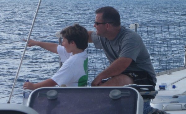 Pat sailing with his son in the Caribbean.