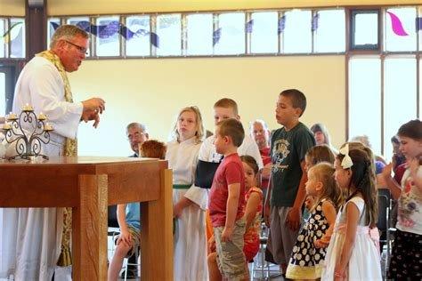 Rev. Wesley Howell speaks to the children during service.