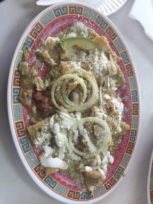 Chilaquiles. Fried corn tortillas with cheese and green sauce.