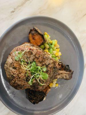 Prime pork chop with succotash and sweet potato