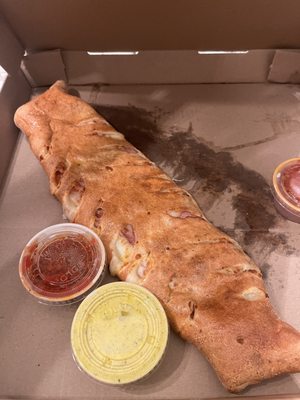 Stromboli with marinara and garlic sauce.