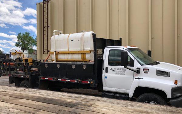 Flatbed getting ready to be serviced at Rocky Mountain Spring & Suspension.