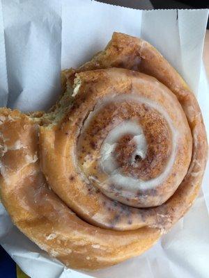 Cinnamon roll donut with a bite taken out!