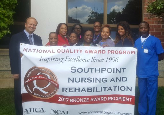 Administrator, John Stare (far left), and staff gather to celebrate their 2017 American Health Care Association QUALITY award.