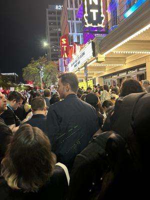 It's crazy out here waiting to get inside for the "Monkey Man" premiere! SXSW 2024