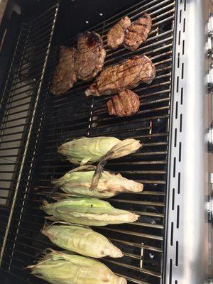 Grilled corn with paprika, cayenne salt pepper and dealers choice ribeyes, filet mignon, New York strip on my grill :)