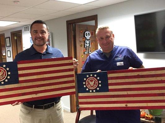 Owners Sean Davis (left) and Greg Davis and their gifts from the office staff for Bosses' Day 2017.