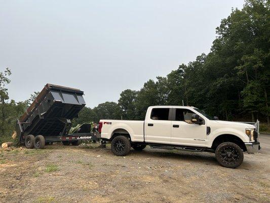 Dump trailer and the truck that hauls it