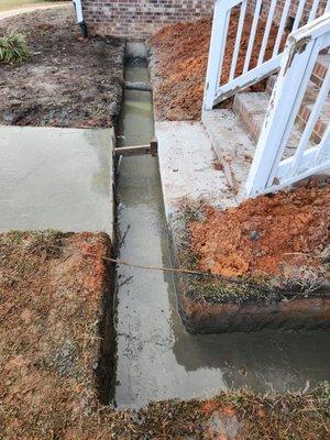 Once the footing was excavated, we poured the concrete.