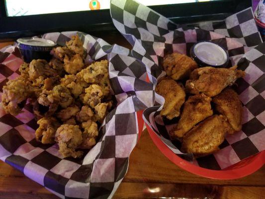 Fried mushrooms with horseradish dip and the wings are fried, no breader and tossed in your choice of sauce. I ate it all but a few wings.