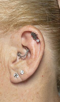 Had the double helixes changed from hoops to titanium flat back labrets. (Web & gem)