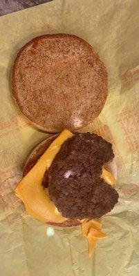 Cheeseburger with a bite took out of it