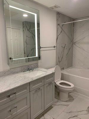 Mock-up Unit. Provided Cabinets, Counters, Vanity Tiles, Tub surround and LED Mirrors