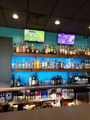 Back bar setup! Smaller TVs and lots of liquors to choose from!