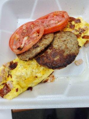 American Omlette-bacon,ham,cheese side of sausage patties and tomato