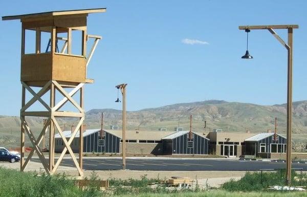 A reconstructed guard tower overlooks the Heart Mountain Interpretive Learning Center.