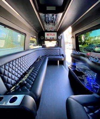 Inside our Mercedes Sprinter Limo, equipped with Wifi, streaming, beverage and snack options. Perfect for day trips, city tours, and more.