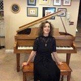 Lisa Handman in her studio with her baby grand piano