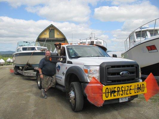 Our truck driver Aaron Barker and boatyard dog Bonnie heading to Mass