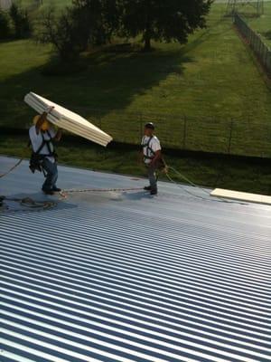 Ettrick Library installing 2 layers of 2" ISO insulation.