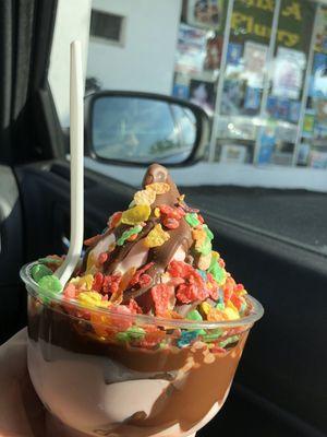 Raspberry soft served dipped in chocolate with fruity pebbles