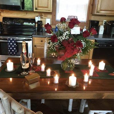 AMAZING bouquet of a Dozen Long-Stem Red Roses, along with candles, Champagne & other goodies for a Proposal Setup. (Btw, she said YES!)