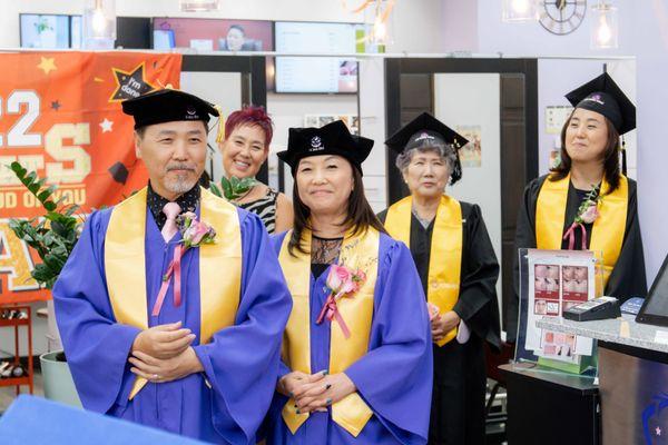 Warren Sohng, Isabella Lee, and student teacher graduates