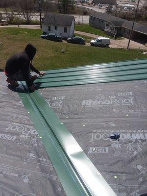 Installing the roofs valley meatal. One @ a time