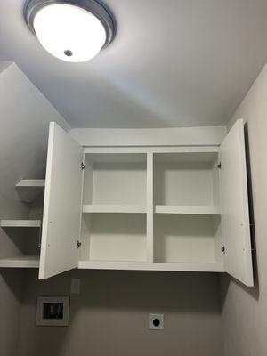 Final picture of laundry cabinet with shelves and painted