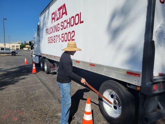 Student conducting a pre-trip inspection