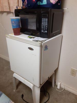 Refrigerator and microwave in room