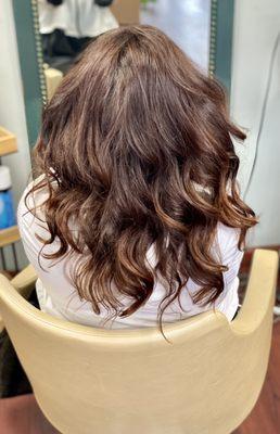 Beautiful chestnut hair styled with textured Waves