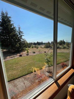 Photo of a large glass window that had grime