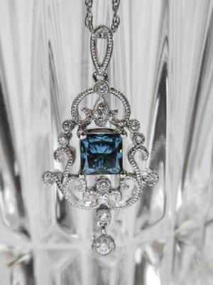 A gorgeous 1.02 carat blue diamond in a white gold and white diamond setting.