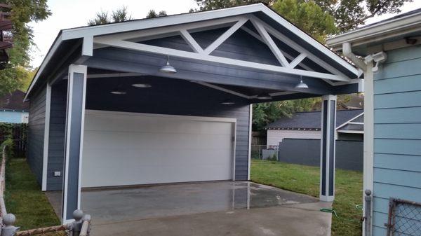 New construct detached garage with covered porch