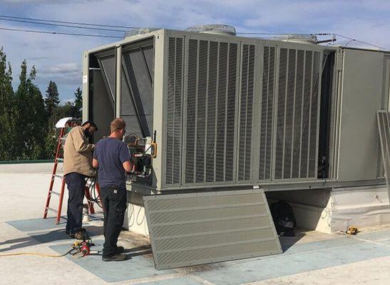 Commercial roof-top A/C packaged unit installation