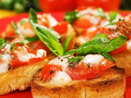 Fresh Tomatoes, Parmesan Cheese, Garlic, Green Onions & Olive Oil on Toasted Baguette Bread