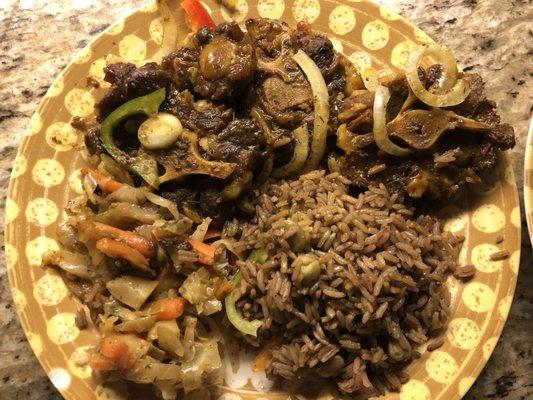 Oxtail, dirty rice, and cabbage! Delicious!