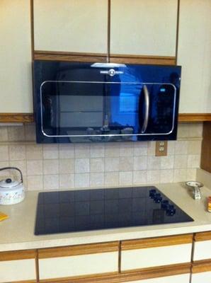 Added new stove top and replaced ceramic tiles backsplash throughout kitchen area.